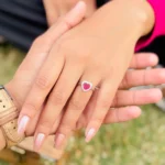 Silver Heart-Shaped Ring with Pink Heart Stone Center.