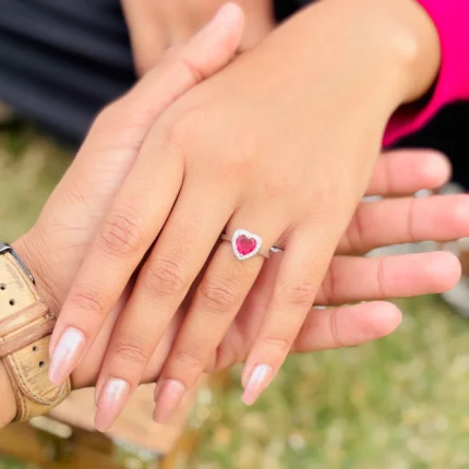 Silver Heart-Shaped Ring with Pink Heart Stone Center.